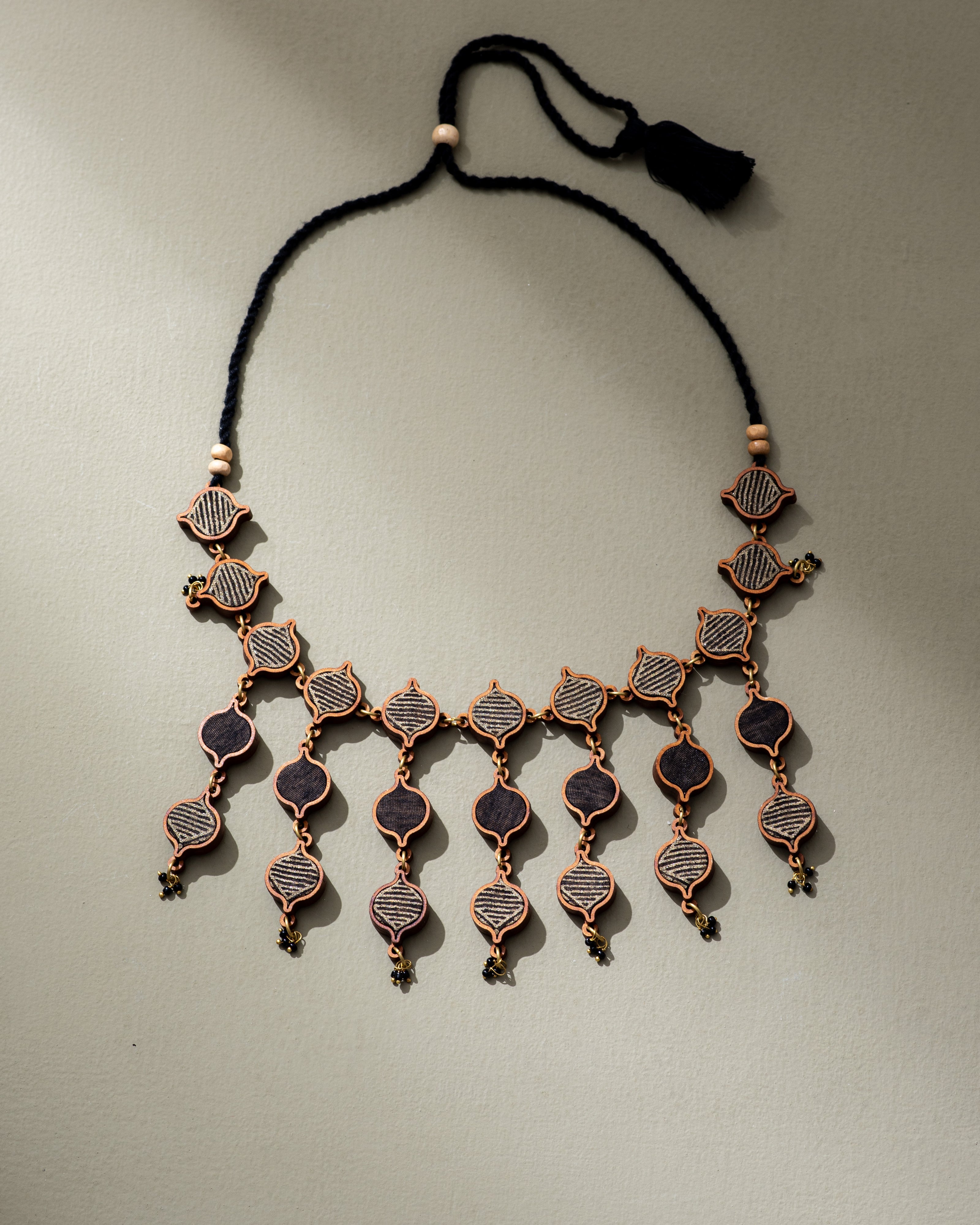 WHE Black and Gold Festive Multi Layered Repurposed Fabric and Wood Necklace